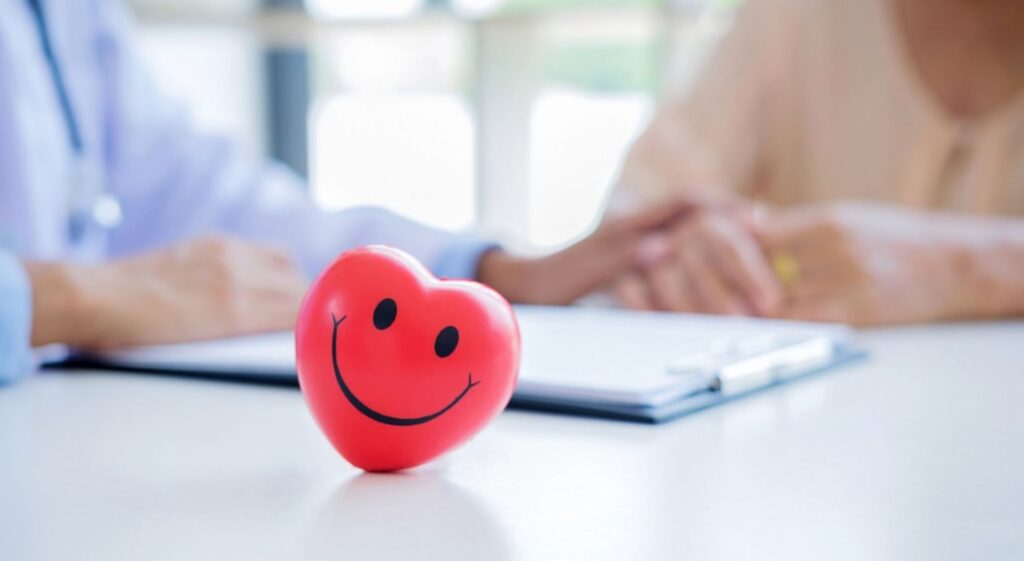 Provider offering compassionate, patient-centered care during a consultation.